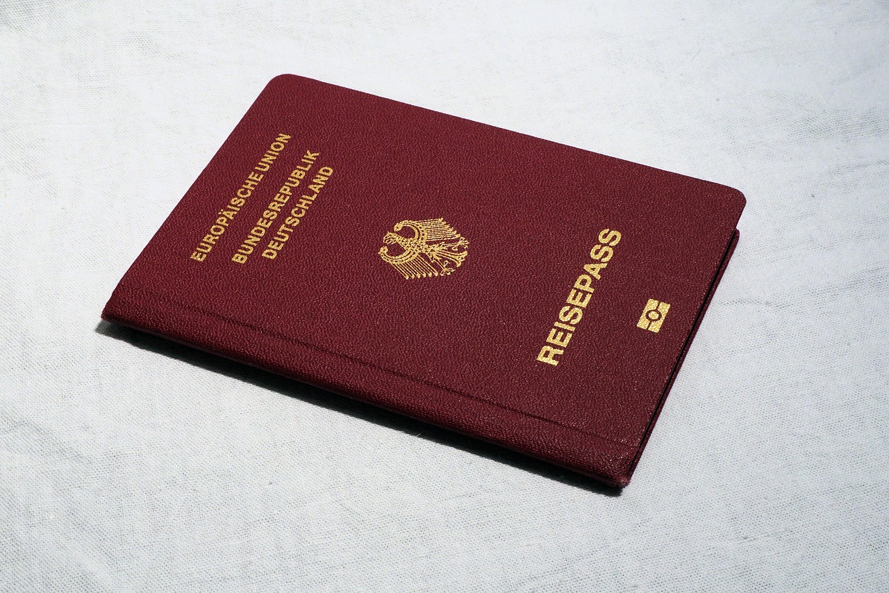 Sharp passport and travel identity documents arranged on a desk