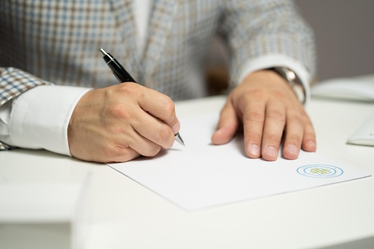 Person signing a legal document and Power of Attorney